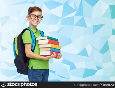 childhood, school, education and people concept - happy smiling student boy in eyeglasses with school bag and books over blue low poly texture background