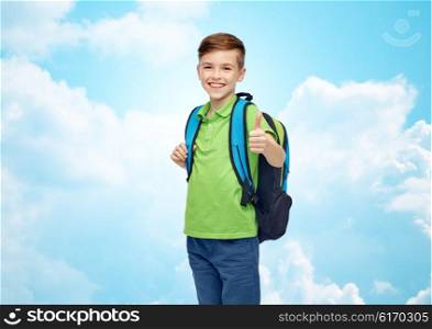 childhood, school, education and people concept - happy smiling student boy with school bag over blue sky and clouds background