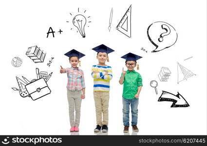 childhood, school, education, knowledge and people concept - happy children in bachelor hats or mortarboards and eyeglasses over doodles