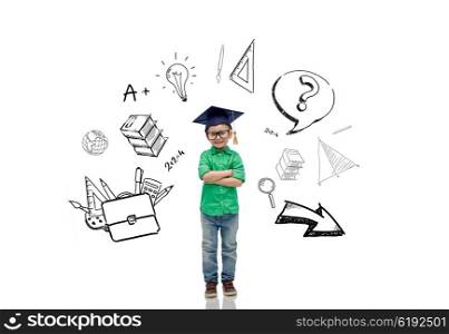 childhood, school, education, learning and people concept - happy boy in bachelor hat or mortarboard with doodles