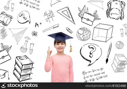 childhood, school, education, learning and people concept - happy girl with in bachelor hat or mortarboard with doodles