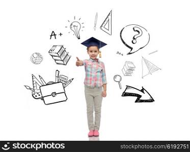 childhood, school, education, learning and people concept - happy girl with in bachelor hat or mortarboard showing thumbs up with doodles