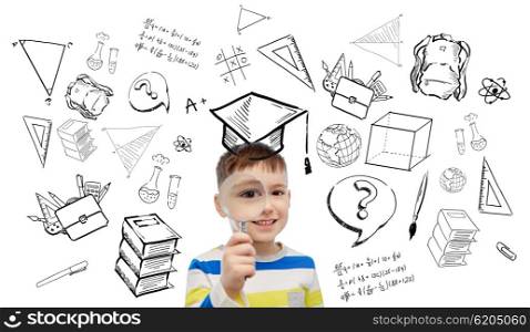 childhood, school, education, learning and people concept - happy little boy looking through magnifying glass with doodles