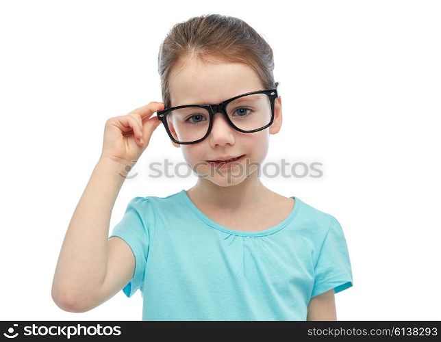 childhood, school, education, vision and people concept - happy little girl in eyeglasses