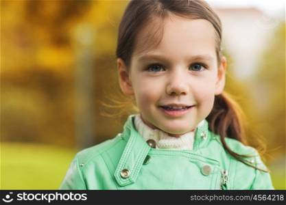 childhood, season and people concept - happy beautiful little girl portrait outdoors