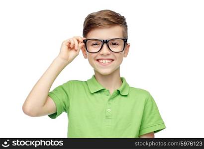 childhood, vision, school, education and people concept - happy smiling boy in green polo t-shirt in eyeglasses