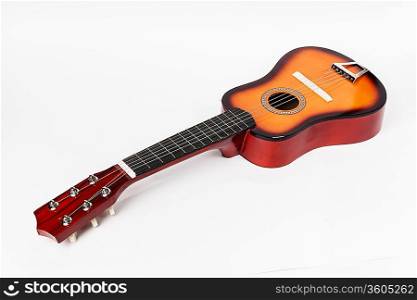 Children&acute;s Acoustic Guitar on a white background