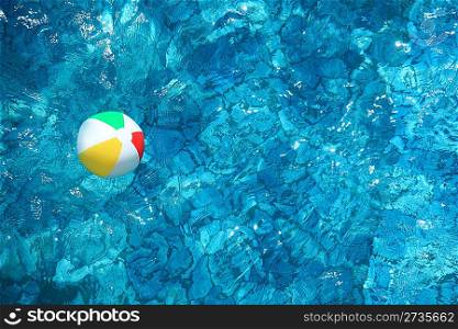 Children&acute;s ball in water pool
