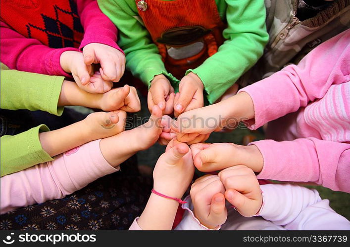 Children&acute;s hands show sign ok, top view