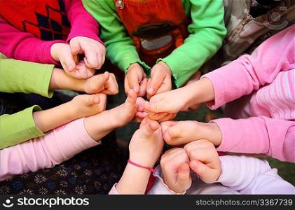 Children&acute;s hands show sign ok, top view