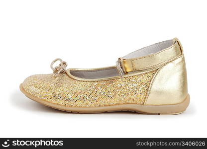 Children&acute;s shiny golden shoe for the girl on a white background.