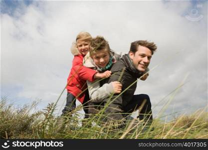 Children and father outdoors