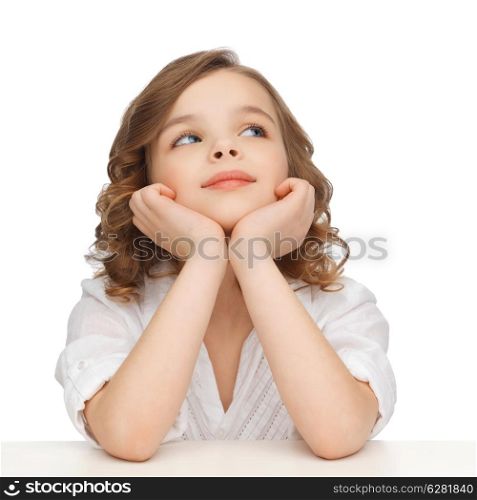 children and happy people concept - picture of pre-teen girl in casual clothes looking up and thinking