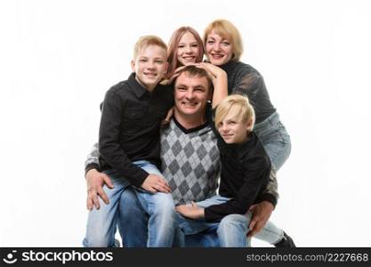 Children and mom hug happy dad, portrait of large adult family, isolated on white background a. Children and mom hug happy dad, portrait of large adult family, isolated on white background