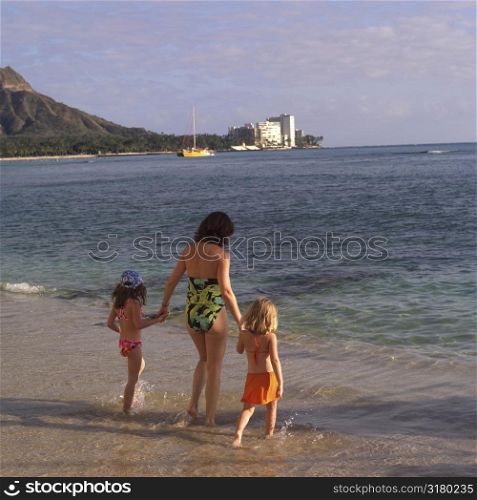 Children and mother at the beach