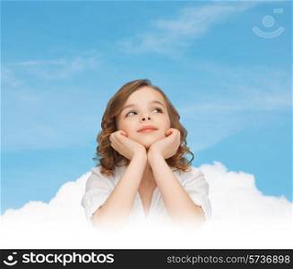children, childhood, ecology and happy people concept - beautiful girl sitting at table, looking up and dreaming over blue sky and cloud background