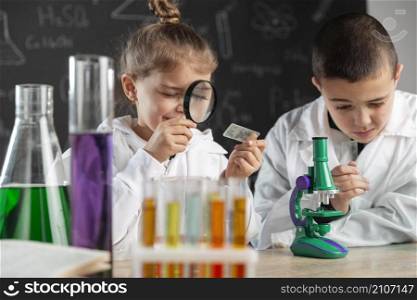children doing experiments laboratory