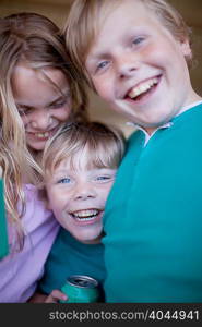 Children drinking soda in garage