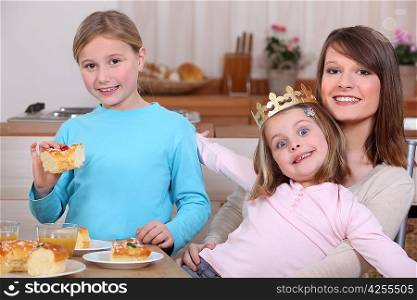 Children eating a French &acute;galette de rois&acute;