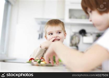 Children eating together at table