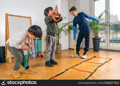 Children Exercising with Resistance Bands Indoors