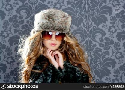 children fashion blond girl with fur winter coat sunglasses and hat