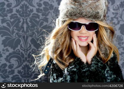 children fashion blond girl with fur winter coat sunglasses and hat