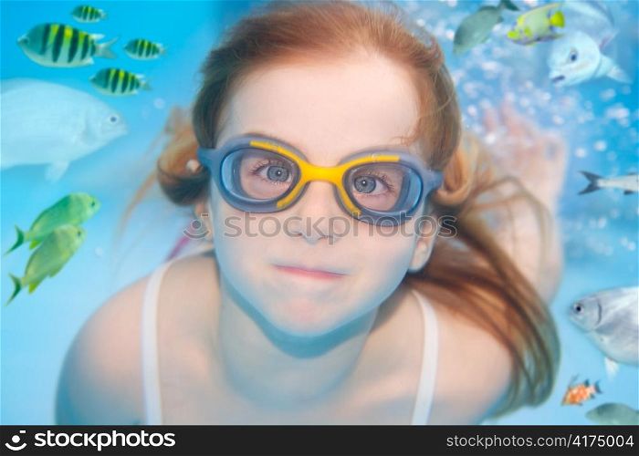children girl underwater goggles swimming underwater with fishes