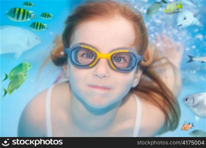 children girl underwater goggles swimming underwater with fishes