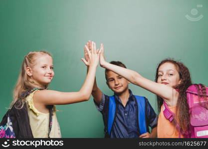 children giving high five