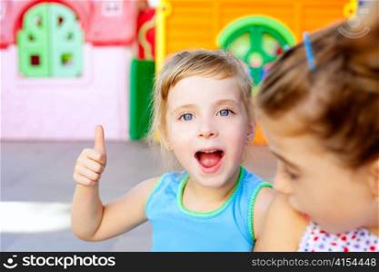 children happy little sister girls with ok hand gesture