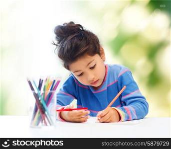 children, hobby, childhood and happy people concept - little girl drawing over green background