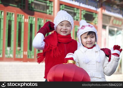 Children holding red lantern