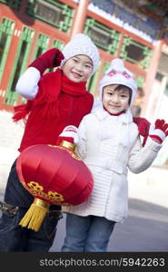 Children holding red lantern