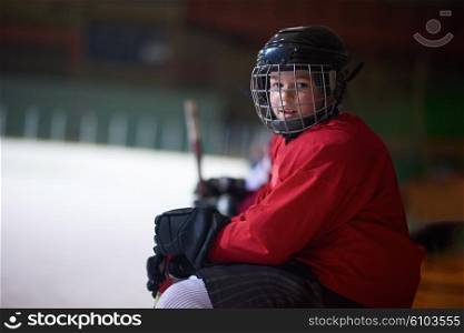 children ice hockey players, group of people, team friends waiting and relaxing on bench to start game