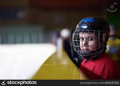 children ice hockey players, group of people, team friends waiting and relaxing on bench to start game