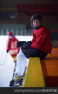 children ice hockey players, group of people, team friends waiting and relaxing on bench to start game