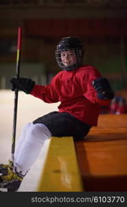 children ice hockey players, group of people, team friends waiting and relaxing on bench to start game