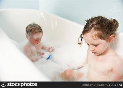 Children in bubble bath together