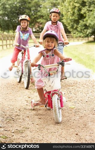 Children In Countryside Wearing Safety Helmets