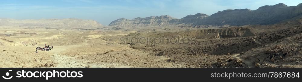 Children inside crater Makhtesh Katan in Negev desert, Israel