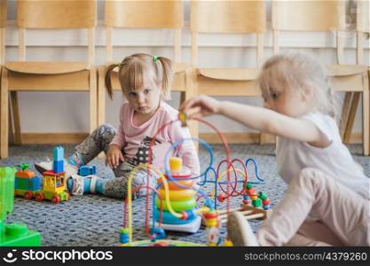children kindergarten with toys