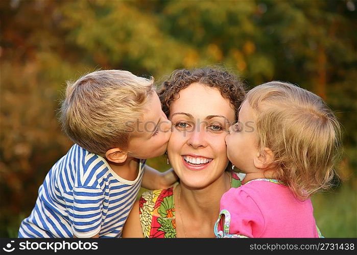 children kiss the mother