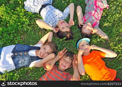 children laying together on ground