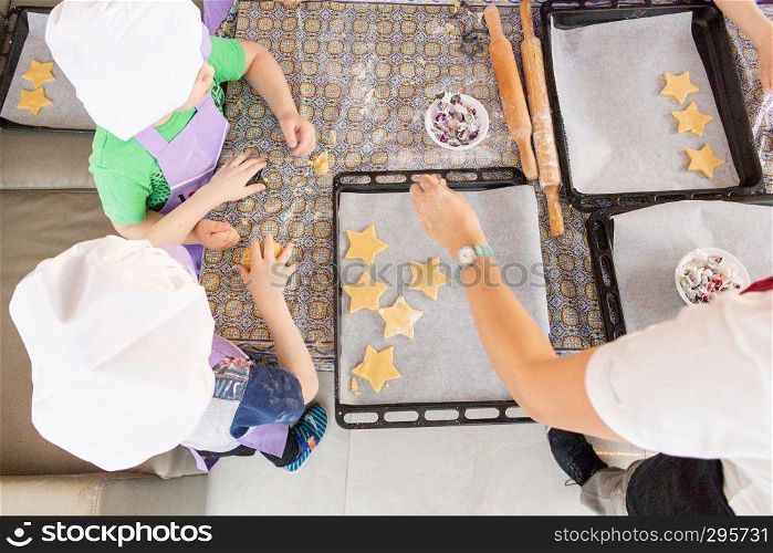 Children learn to cook cookies in the form of an asterisk. Fitness club global.. Khabarovsk, Russia - Feb17, 2018: cooking class for the production of cookies for his father in honor of the defender of the Fatherland.
