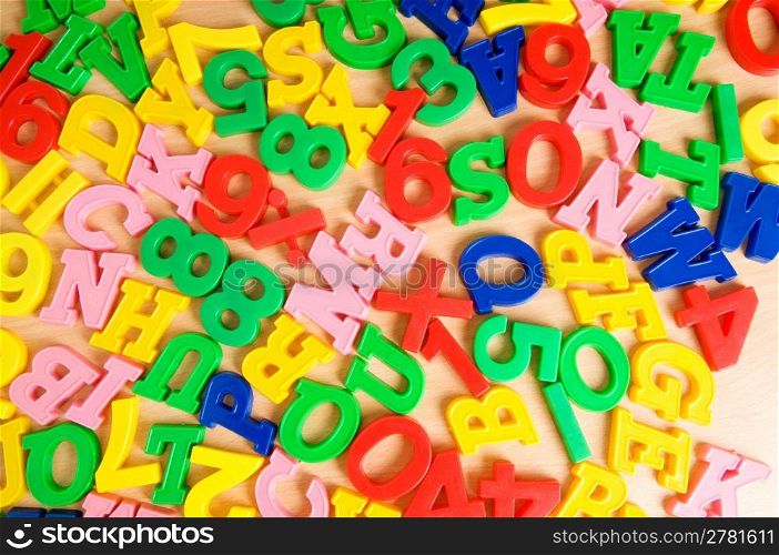 Children letters and digits on the table