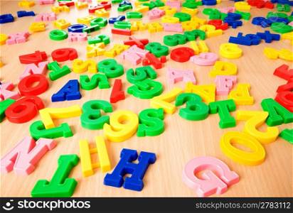 Children letters and digits on the table