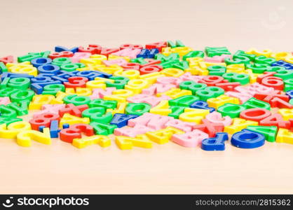 Children letters and digits on the table