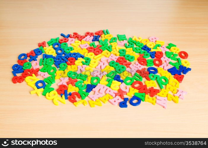 Children letters and digits on the table