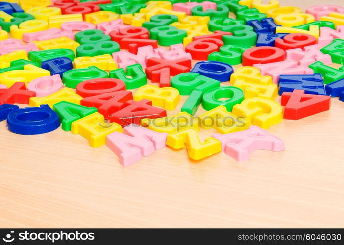 Children letters and digits on the table